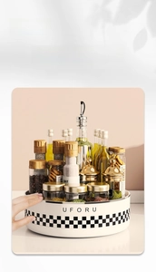 Close-up of rotating kitchen spice tray with checkered pattern for organizing bottles