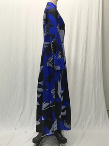 Detailed side view of A-line floral print maxi dress featuring high neck and long sleeves