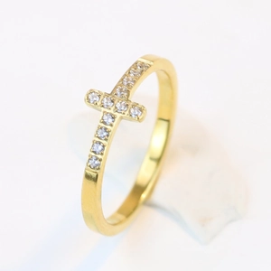 Detailed close-up of 7mm gold stainless steel ring featuring a micro-pave diamond cross