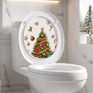 Detailed view of festive Christmas tree and holiday decals applied on a white toilet lid