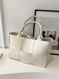 Chic beige woven tote bag with large capacity and soft faux leather texture for women
