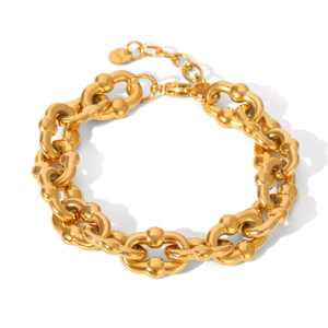 Detail view of 18K gold plated stainless steel thick chain bracelet on white backdrop