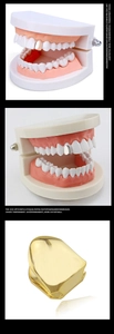 Vista macro di un singolo grillz hip-hop placcato in oro con dettagli su un modello di dente