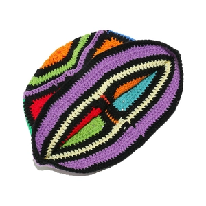 Detailed close-up of handmade crochet bucket hat with colorful geometric knit patterns