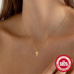 Minimalist S925 sterling silver cross necklace in gold worn by a model for elegant style