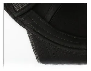 Detail shot of the wide moisture-wicking sweatband and fine stitching on the cap