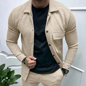 Detail shot of men's beige twill jacket showing waffle texture and lapel collar