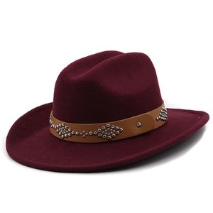 Detail of burgundy wool fedora featuring a leather band with silver metallic studs