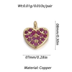 Macro detail of a 14k gold-plated heart pendant with purple zircon and copper material specs