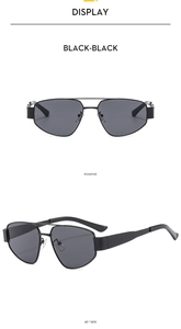 Detail view showing black aviator sunglasses with double bridge and wide temples