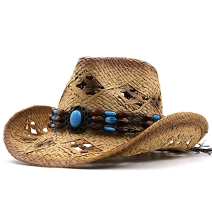 Detail of hollow straw weave cowboy hat with turquoise stone and wooden bead band