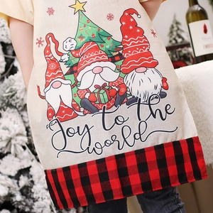 Christmas gnome apron in beige fabric with red-black plaid trim and festive pattern