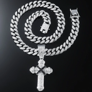Silver Cuban chain necklace with iced out cross pendant featuring a black center cross