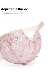 Detail of pink mesh baseball cap featuring adjustable buckle and floral sequins