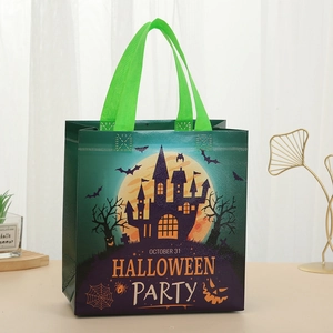 Halloween non-woven gift bag with green handles, castle and pumpkin lantern prints