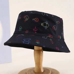 Kids black bucket hat with colorful animal graffiti print and puppy text on wooden stand