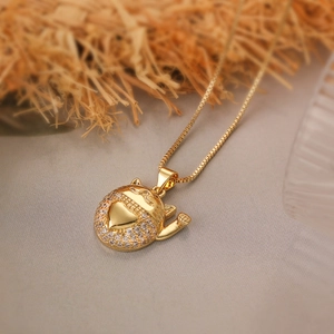 Gold plated lucky cat pendant necklace with sparkling cubic zirconia on a box chain