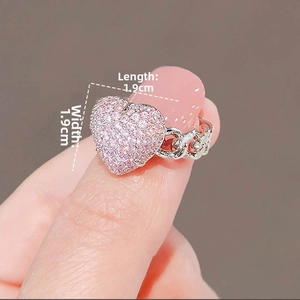 Detailed view of silver chain ring with a large pink crystal heart measuring 1.9cm