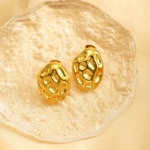 Textured 18k gold plated irregular pebble earrings with hammered finish on silk