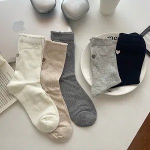 Five pairs of women's mesh crew socks with heart embroidery and ruffled rib cuffs