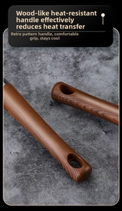 Detail of ergonomic heat-resistant faux wood handle with hanging hole on a 304 ladle