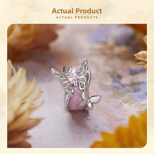 Detailed view of S925 silver butterfly charm with pink enamel and heart-shaped gemstone