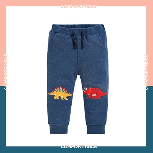 Detail of navy kids joggers with elastic waist, drawstring and dinosaur knee patches