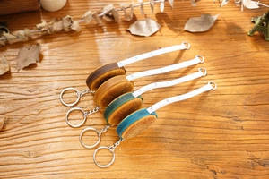 Macro shot of assorted vintage crazy horse leather measuring tapes on wood background