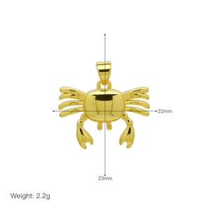 Detail of gold crab pendant measuring 22mm by 23mm and weighing 2.2g on white background