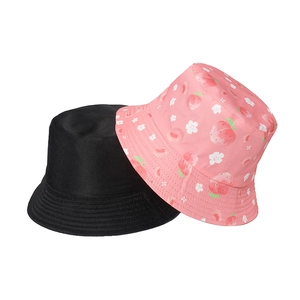 Detail of cotton sun hats showing one plain black and one pink peach floral pattern