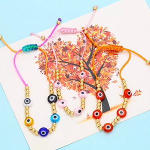 Close-up of Bohemian evil eye beaded bracelets with adjustable nylon woven cords
