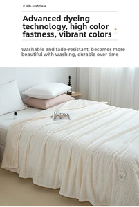 Detailed view of cream textured milk fleece blanket with 3D waffle pattern design