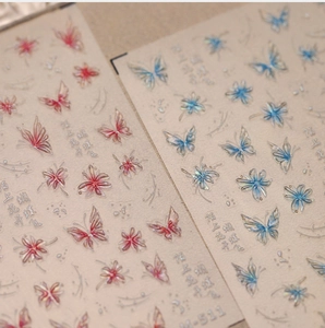 Detailed relief of pink butterfly and floral nail art stickers with 3D embossed texture