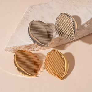 Metallic striped comb earrings in gold and silver finish with elegant leaf patterns
