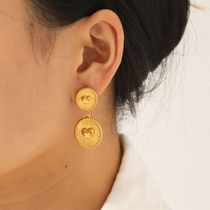 18K gold plated stainless steel heart geometric earrings worn by a model