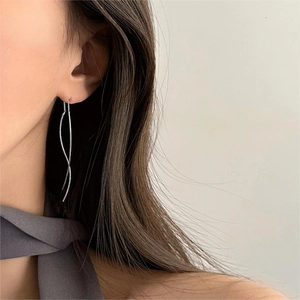 Minimalist S925 sterling silver wave drop earrings shown on model for elegant look