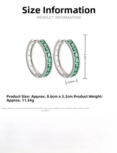 Detail view of silver C-shaped earrings with square-cut emerald-green stones and dimensions