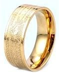 Detailed view of wide gold band ring with engraved scriptures and metallic luster