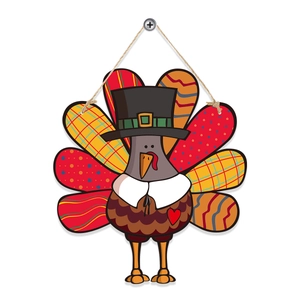 Detail of wooden cartoon turkey hanging decoration with colorful pattern feathers for Thanksgiving