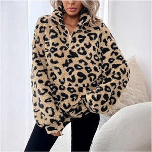 Detailed texture of leopard print faux fur sweatshirt with half-zip collar design