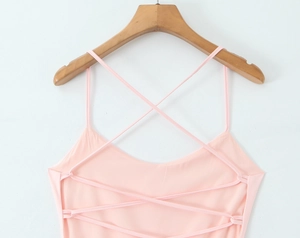 Detail view of the pink dress featuring intricate back crisscross lacing and backless design
