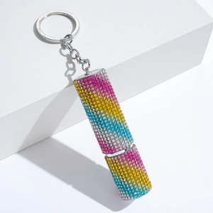 Detail of rainbow rhinestone perfume bottle keychain with crystal gradient and metal ring