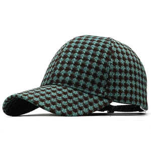 Classic houndstooth knitted baseball cap in blue and brown with curved brim for outdoor style