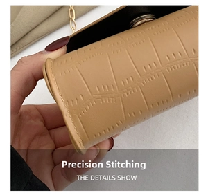 Close-up of precise stitching and crocodile texture on light brown crossbody bag