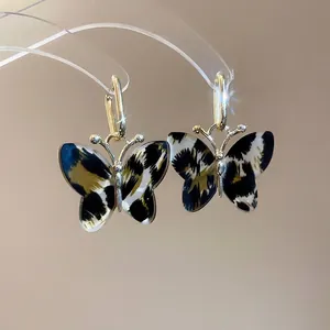 Vintage leopard print acetate butterfly pendant earrings with gold metal hooks and luxury finish