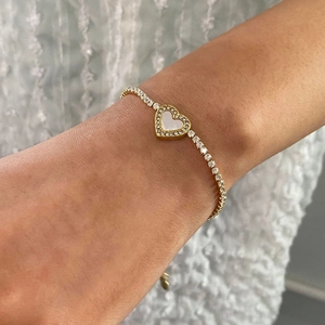 Goudkleurige roestvrijstalen tennisarmband met hart van schelp en kristallen