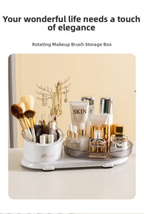 Close-up of rotating cosmetic organizer with gold jewelry tree and brush compartments