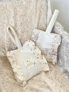 Floral quilted cotton wrist bags in yellow and pink styles with frilled edge decor