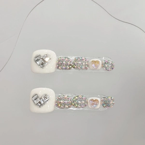 Handmade white press-on toenails with heart rhinestone design and colorful crystals