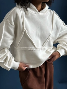White Y2K drawstring hoodie with frayed bust detail and diagonal twill fabric texture